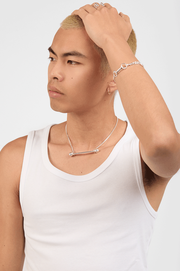 Model in a white tank top and Barred necklace in silver |all 