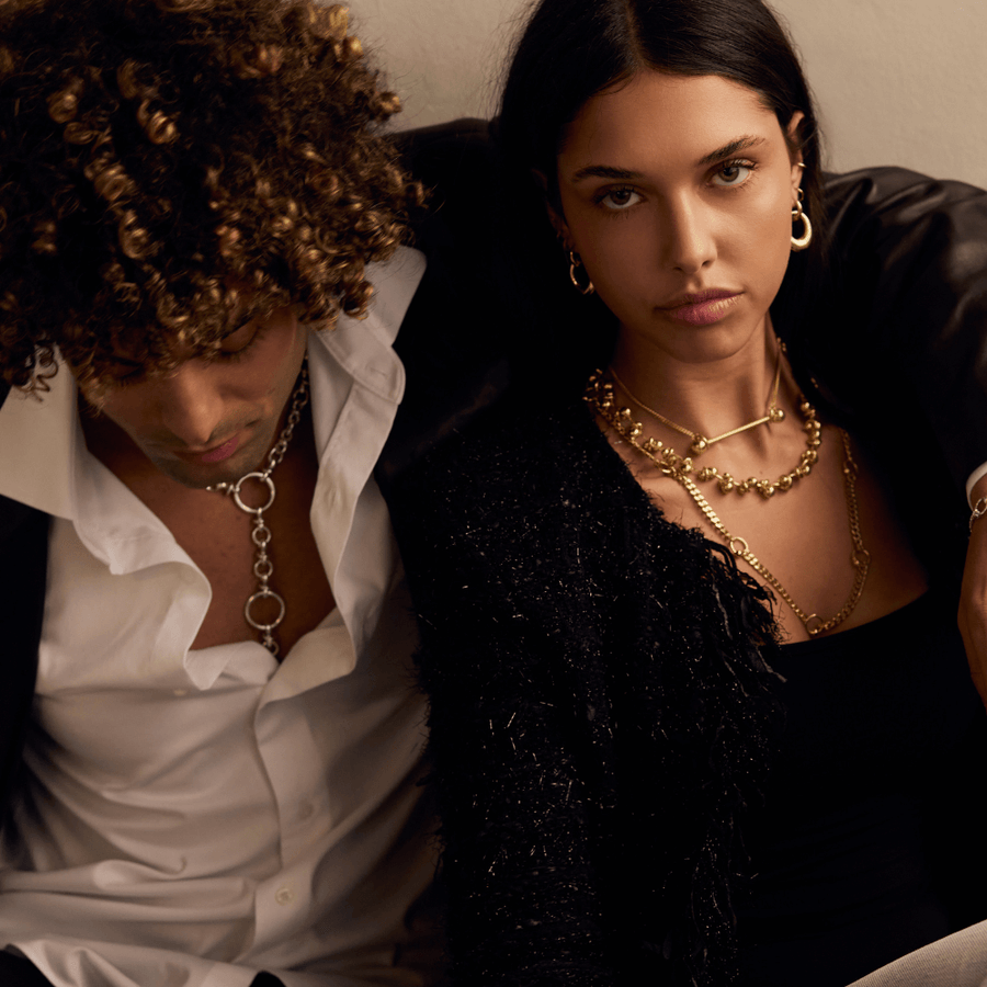 A couple wearing layered Annabel B jewellery