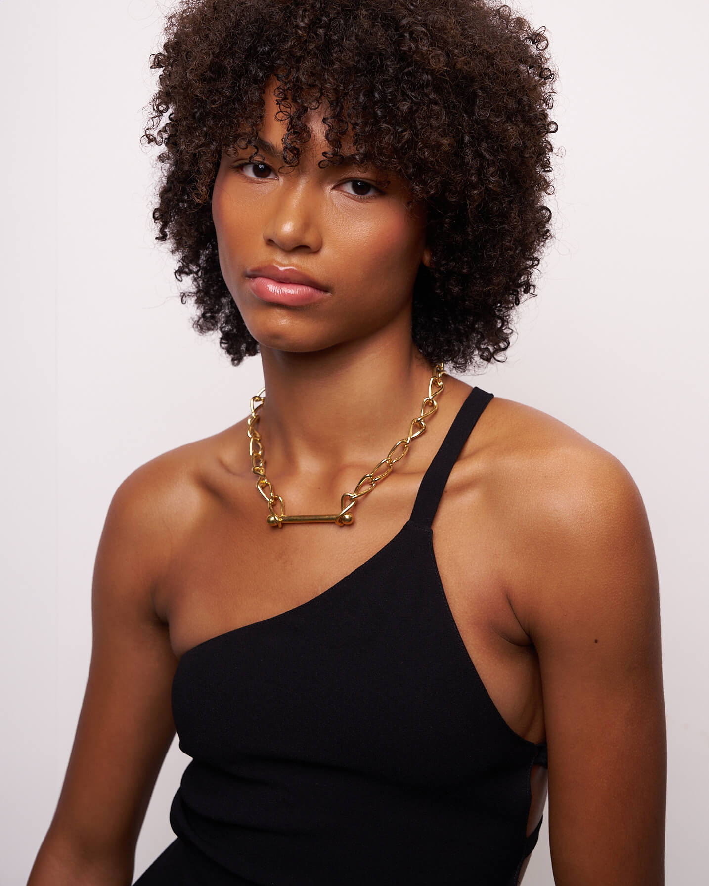 Model wearing the gold Infinity Barred Necklace