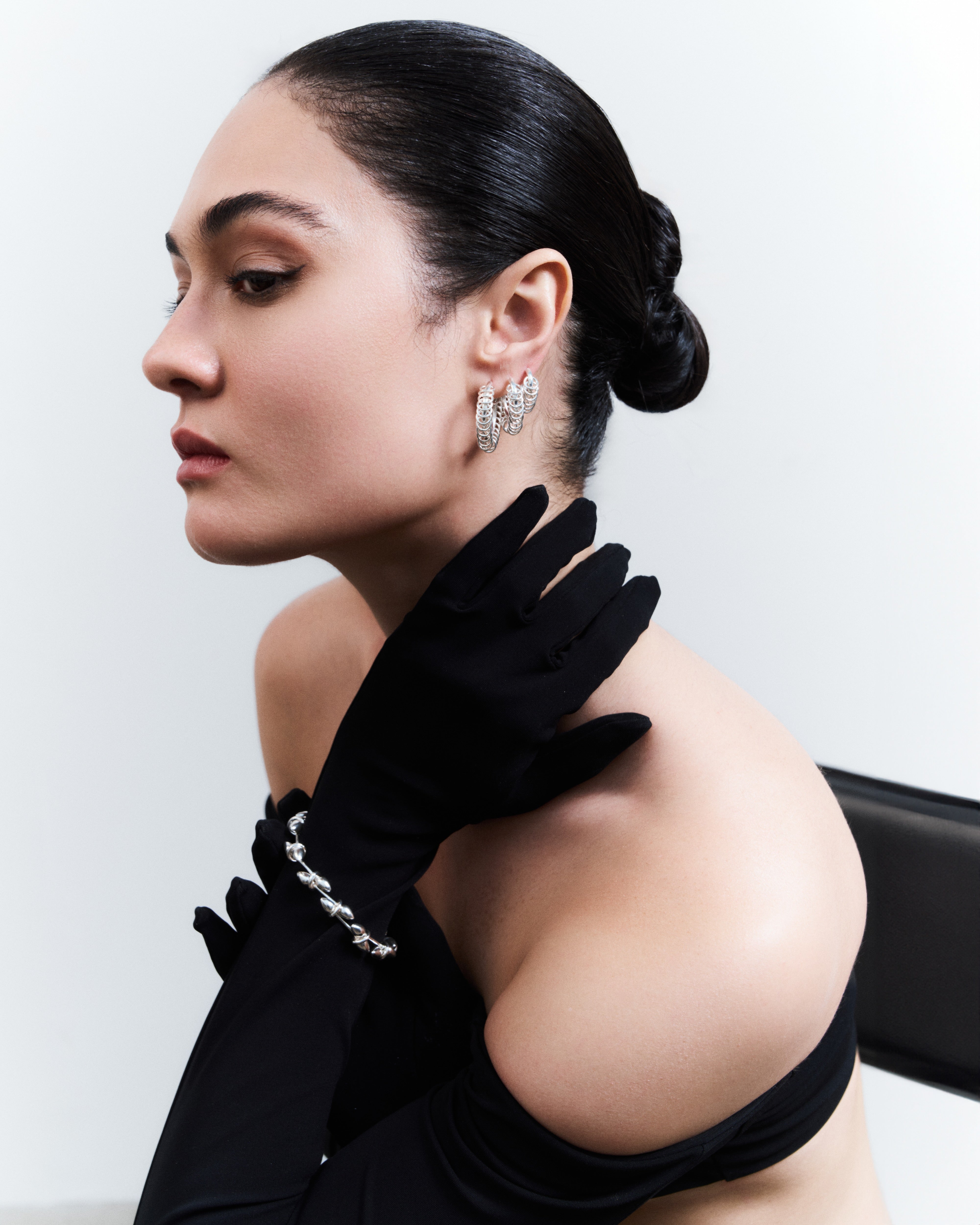 Model wearing the Le But 1 Bracelet in silver