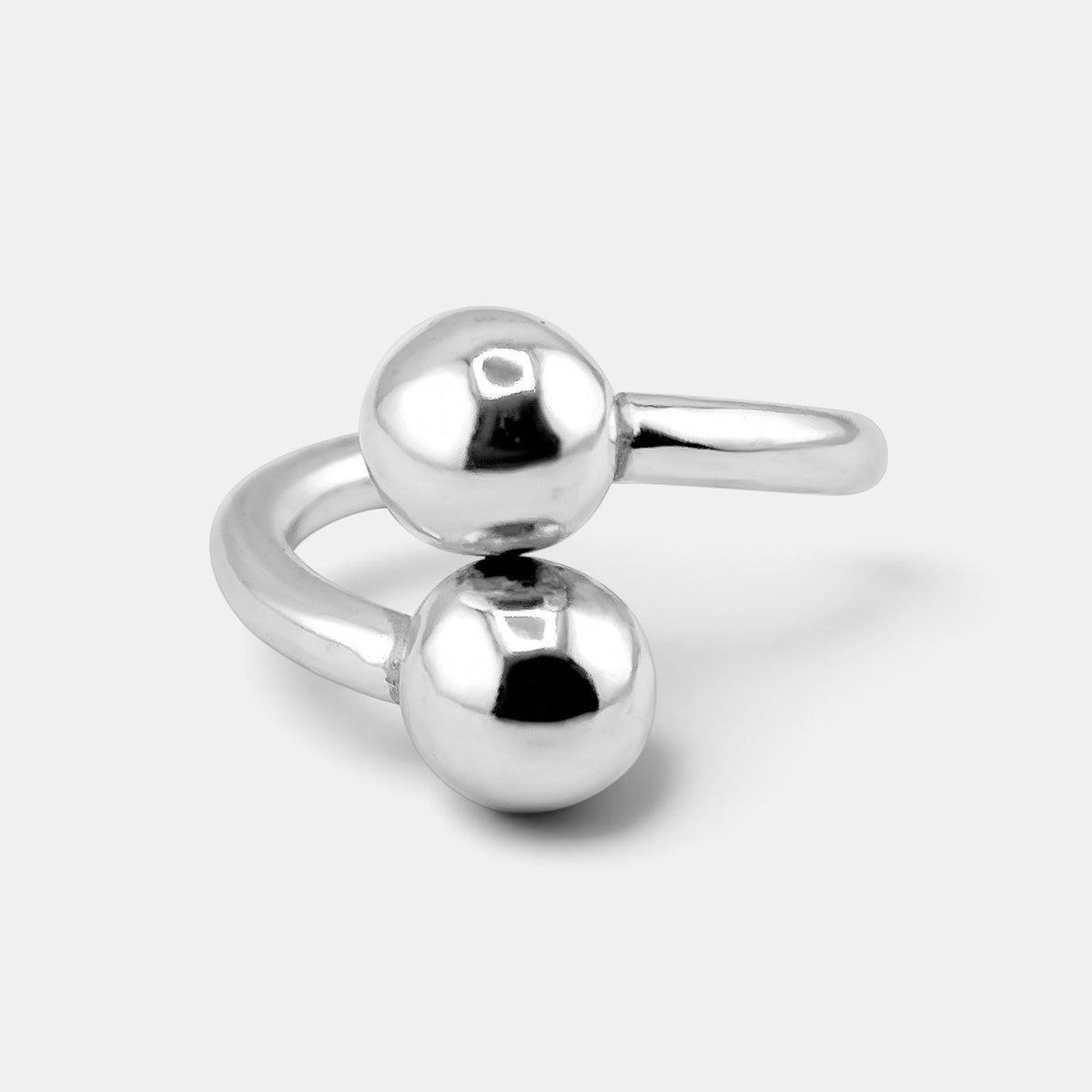 annabel-b 2Balls ring in polished sterling silver featuring two sculptural spheres in a diagonal design