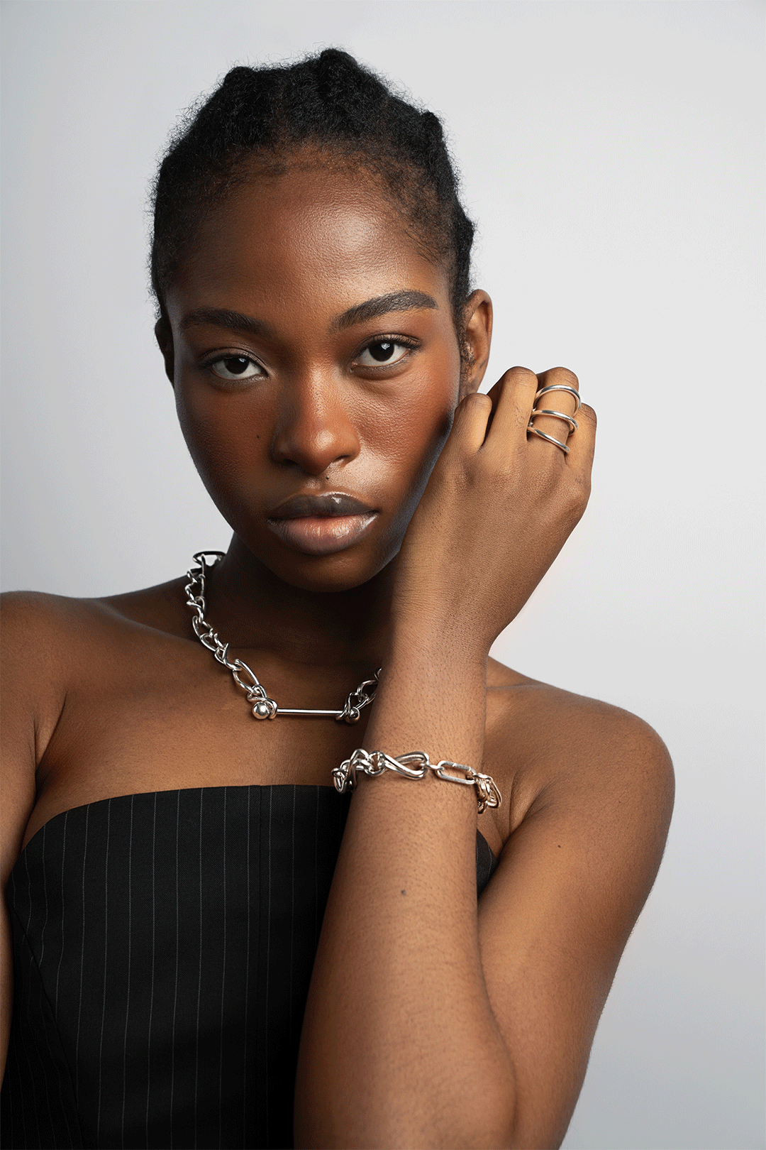 Model wearing the Give3 Ring, Infinity Barred Necklace and Infinity Bracelet in silver